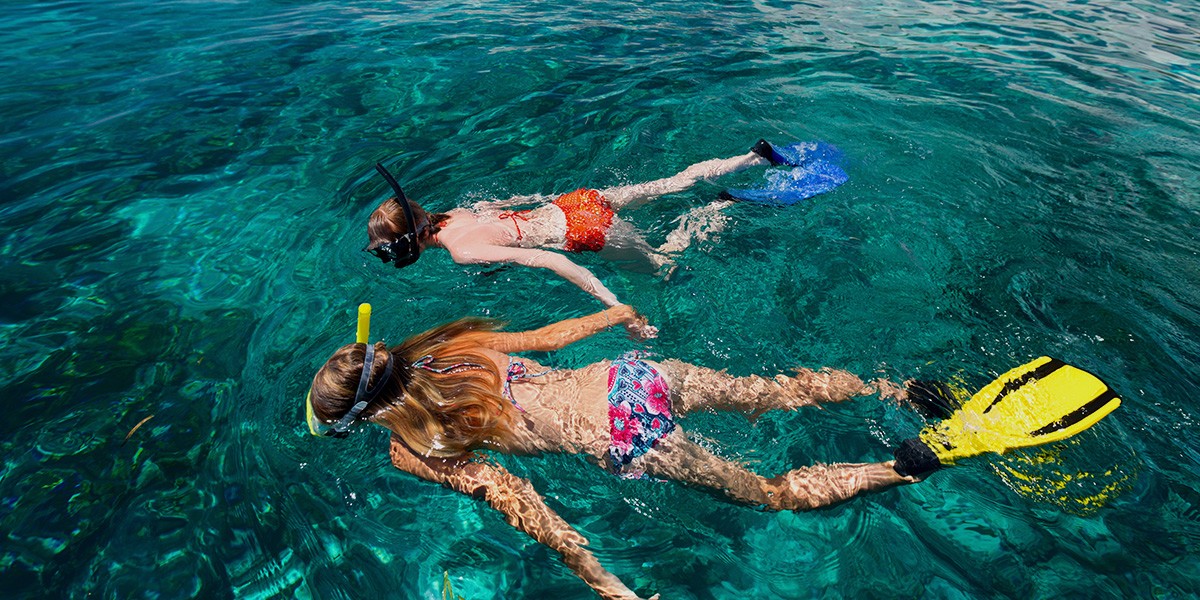 Aqua Play Land Zone -Aqua Play Land Zone 00 Featured two women snorkelling in beautiful water
